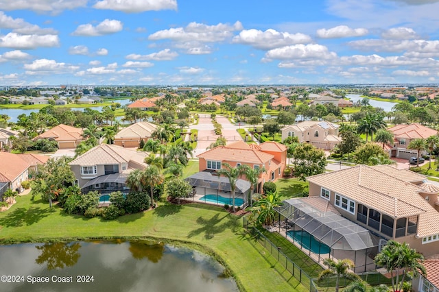bird's eye view featuring a water view and a residential view