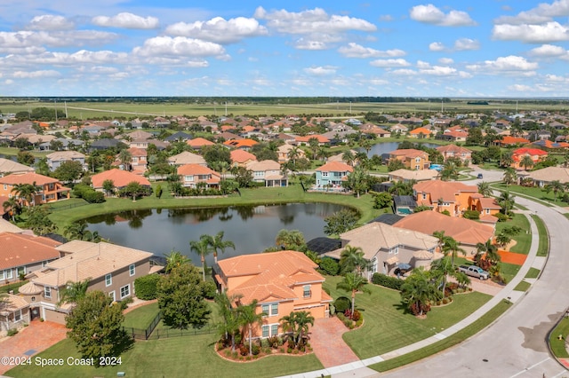 bird's eye view featuring a residential view and a water view