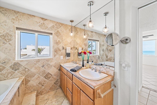 2101 Atlantic St Unit 531, Melbourne Beach, FL 32951 - full bath with a sink, a bath, double vanity, and tile patterned flooring