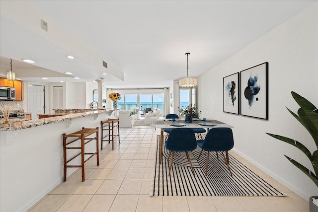 2101 Atlantic St Unit 531, Melbourne Beach, FL 32951 - dining room with visible vents, baseboards, recessed lighting, and light tile patterned floors
