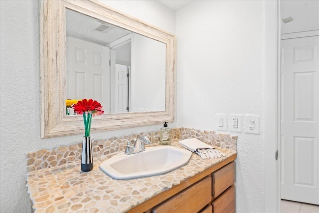 2101 Atlantic St Unit 531, Melbourne Beach, FL 32951 - bathroom with vanity, a textured wall, and visible vents