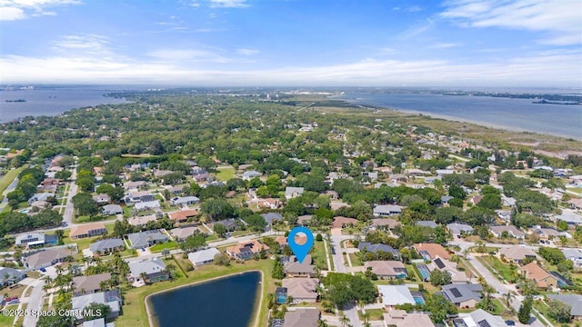 birds eye view of property with a residential view and a water view