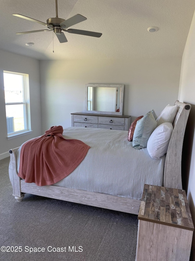 carpeted bedroom with a ceiling fan