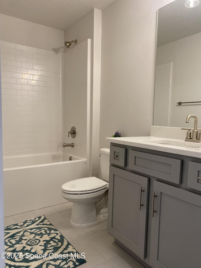full bathroom featuring bathtub / shower combination, a textured ceiling, vanity, toilet, and tile patterned floors