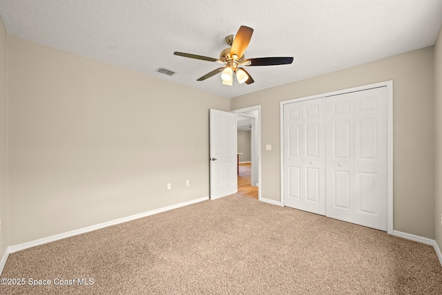 508 Carriage Rd, Indian Harbour Beach, FL 32937 - unfurnished bedroom with visible vents, baseboards, a closet, and carpet
