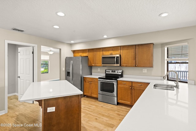 508 Carriage Rd, Indian Harbour Beach, FL 32937 - kitchen with appliances with stainless steel finishes, a sink, visible vents, and a wealth of natural light