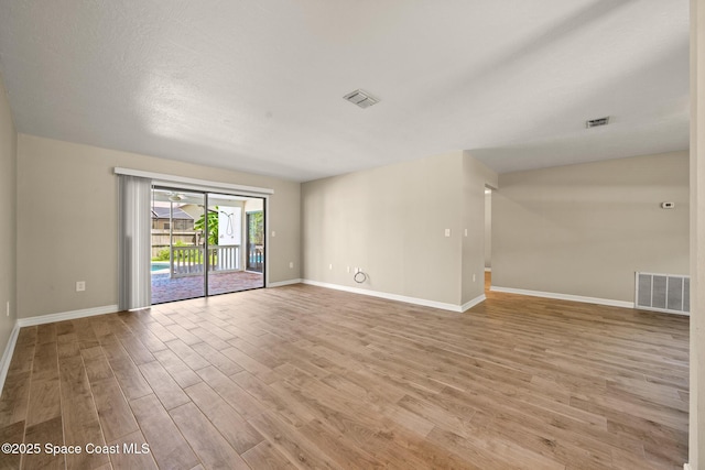 508 Carriage Rd, Indian Harbour Beach, FL 32937 - spare room with light wood-style flooring, baseboards, and visible vents