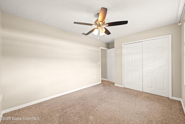 508 Carriage Rd, Indian Harbour Beach, FL 32937 - unfurnished bedroom featuring a closet, a ceiling fan, visible vents, carpet flooring, and baseboards