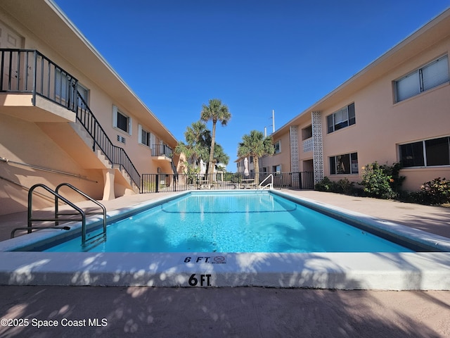 1700 Atlantic St Unit 12, Melbourne Beach, FL 32951 - view of swimming pool with fence