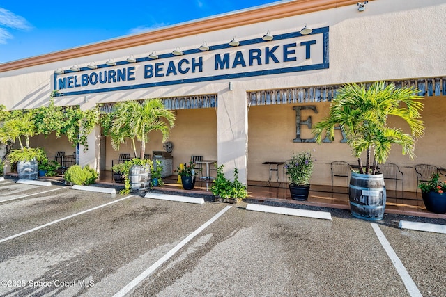 1700 Atlantic St Unit 12, Melbourne Beach, FL 32951 - view of property featuring uncovered parking