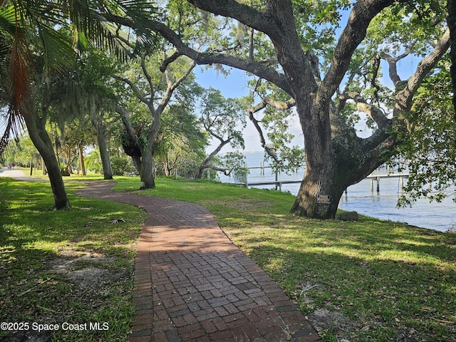 1700 Atlantic St Unit 12, Melbourne Beach, FL 32951 - surrounding community with a yard and a water view