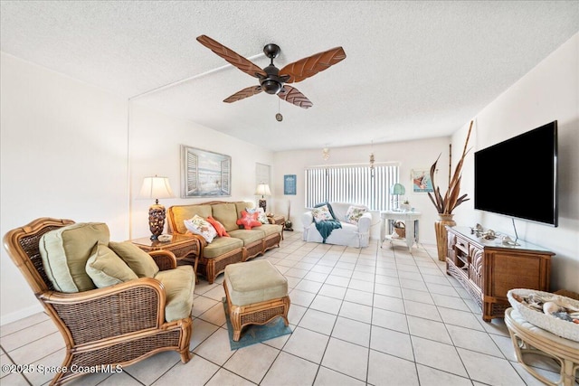 1700 Atlantic St Unit 12, Melbourne Beach, FL 32951 - living area featuring a textured ceiling, ceiling fan, and light tile patterned floors
