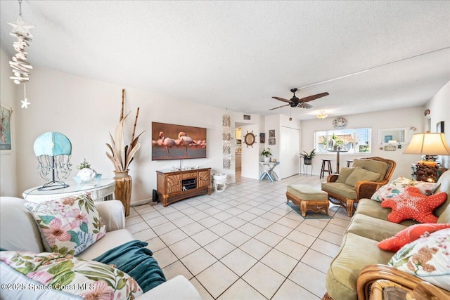 1700 Atlantic St Unit 12, Melbourne Beach, FL 32951 - living room with a ceiling fan, a textured ceiling, visible vents, and light tile patterned floors