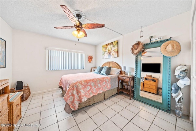 1700 Atlantic St Unit 12, Melbourne Beach, FL 32951 - bedroom with a textured ceiling, a ceiling fan, and light tile patterned floors
