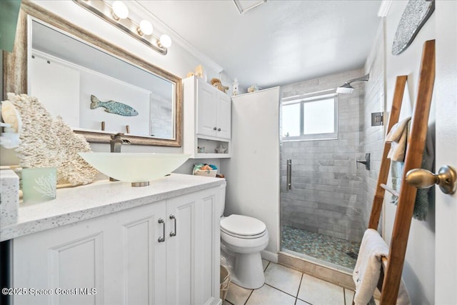 1700 Atlantic St Unit 12, Melbourne Beach, FL 32951 - full bathroom featuring toilet, vanity, tile patterned floors, and a stall shower