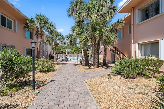 1700 Atlantic St Unit 12, Melbourne Beach, FL 32951 - surrounding community featuring fence and stairway
