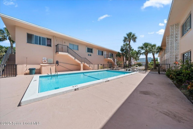 1700 Atlantic St Unit 12, Melbourne Beach, FL 32951 - community pool with fence, stairs, and a patio