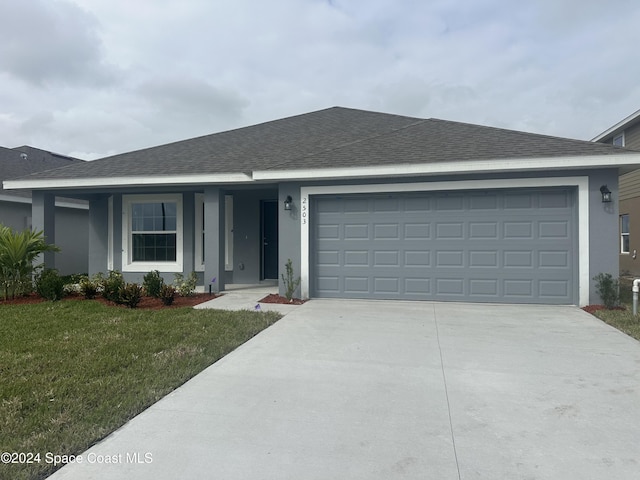1136 Kylar Dr, Palm Bay, FL 32907 - single story home featuring concrete driveway, an attached garage, stucco siding, and a shingled roof