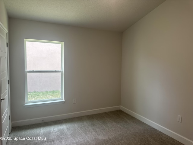 1136 Kylar Dr, Palm Bay, FL 32907 - empty room featuring carpet floors and baseboards