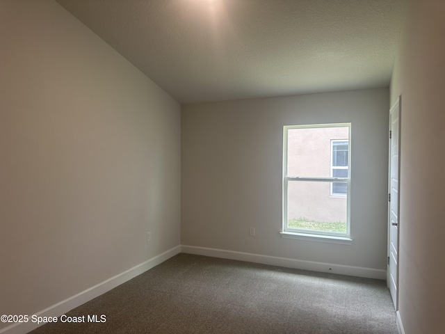 1136 Kylar Dr, Palm Bay, FL 32907 - unfurnished room with carpet floors, baseboards, and a textured ceiling