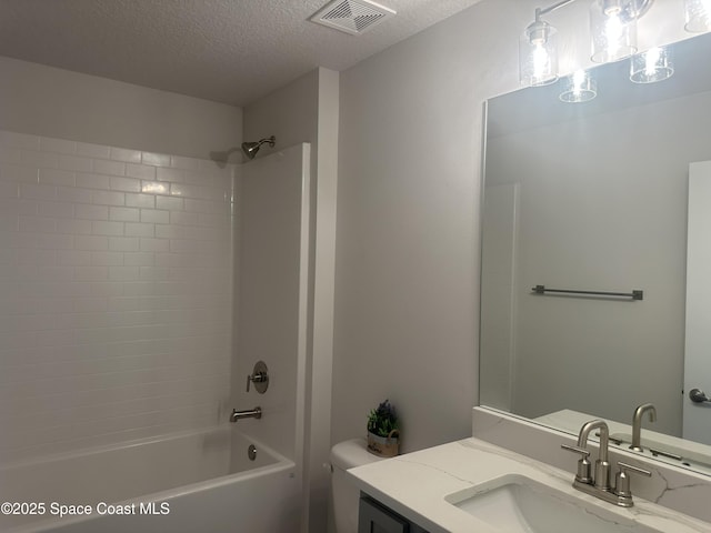 1136 Kylar Dr, Palm Bay, FL 32907 - bathroom featuring vanity, shower / bath combination, a textured ceiling, toilet, and visible vents