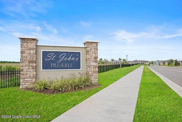 1136 Kylar Dr, Palm Bay, FL 32907 - community sign featuring a yard and fence