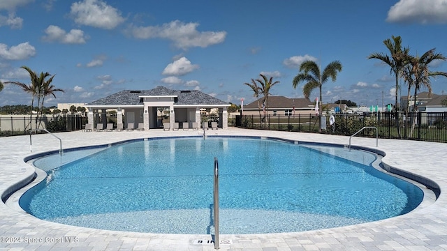 1136 Kylar Dr, Palm Bay, FL 32907 - pool with a patio and fence