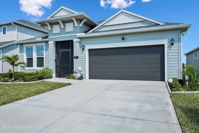 2631 Pinwherry St NW, Palm Bay, FL 32907 - view of front of property with a garage and driveway