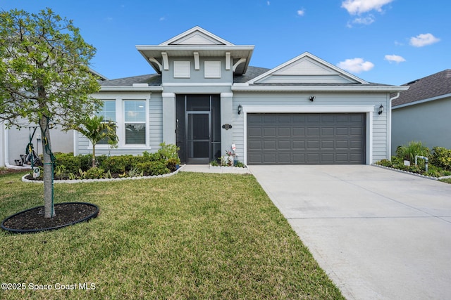 2631 Pinwherry St NW, Palm Bay, FL 32907 - view of front of property featuring a front yard, roof with shingles, a garage, and concrete driveway