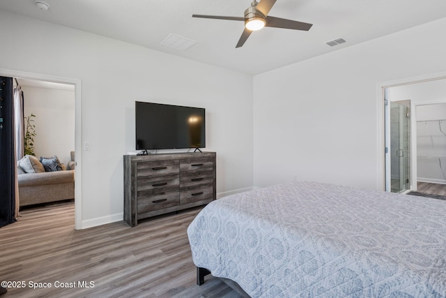 2631 Pinwherry St NW, Palm Bay, FL 32907 - bedroom featuring visible vents, baseboards, a ceiling fan, and wood finished floors