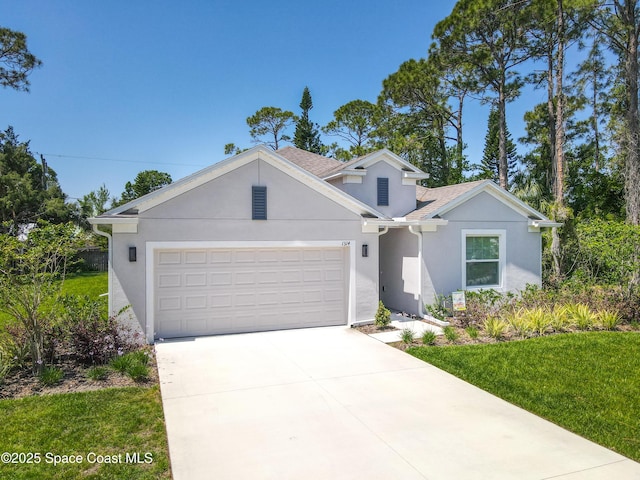 1314 Victory Palm Dr, Edgewater, FL 32132 - view of front of house with concrete driveway, a front yard, stucco siding, and an attached garage