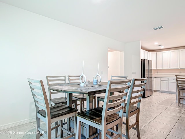 1314 Victory Palm Dr, Edgewater, FL 32132 - dining room with visible vents, baseboards, recessed lighting, and light tile patterned floors
