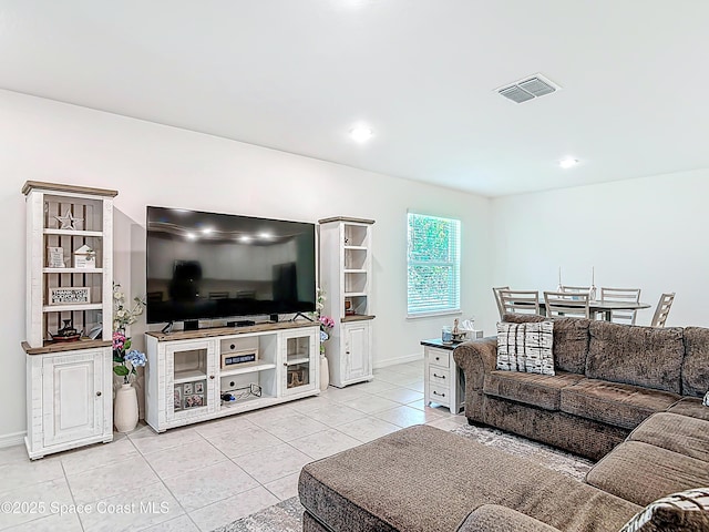 1314 Victory Palm Dr, Edgewater, FL 32132 - living room with light tile patterned floors, visible vents, and baseboards