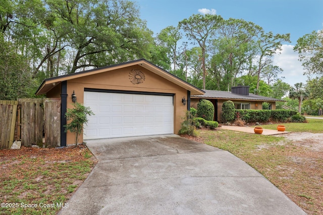 single story home featuring fence, a garage, driveway, and stucco siding