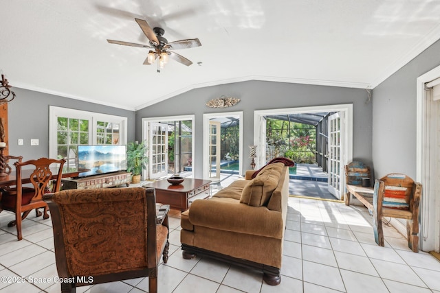 living room with a healthy amount of sunlight, a ceiling fan, crown molding, and lofted ceiling