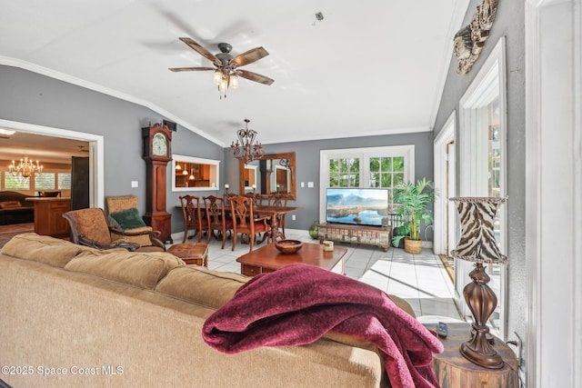 tiled living room featuring baseboards, ceiling fan with notable chandelier, vaulted ceiling, and ornamental molding