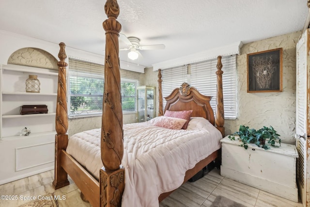bedroom featuring a textured ceiling, ornamental molding, and ceiling fan