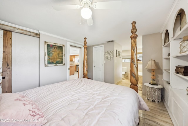 bedroom featuring light wood-type flooring, ornamental molding, a ceiling fan, connected bathroom, and visible vents