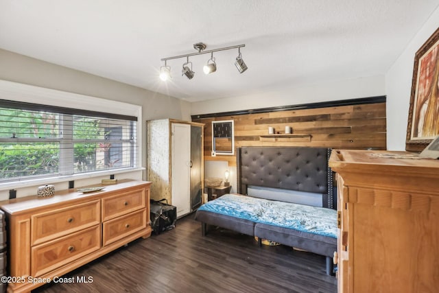 bedroom with dark wood-type flooring