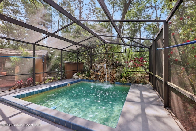 view of pool featuring a lanai