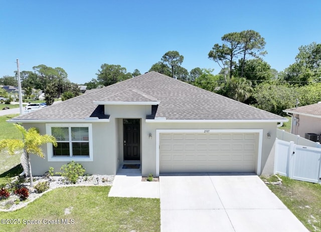2507 Peralta Dr, Palm Bay, FL 32909 - single story home featuring an attached garage, fence, stucco siding, driveway, and roof with shingles