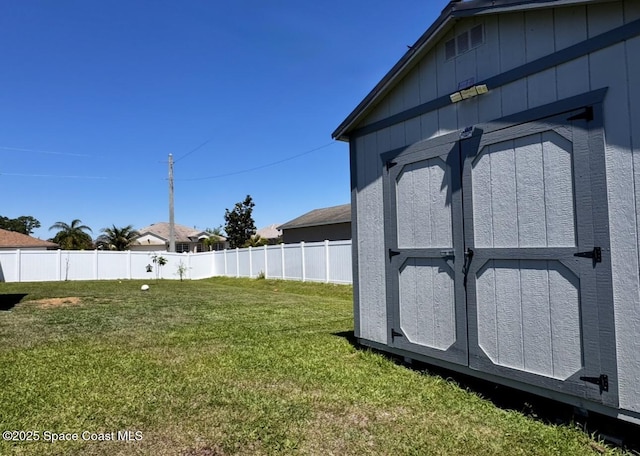 2507 Peralta Dr, Palm Bay, FL 32909 - view of yard with an outdoor structure, fence, and a storage shed