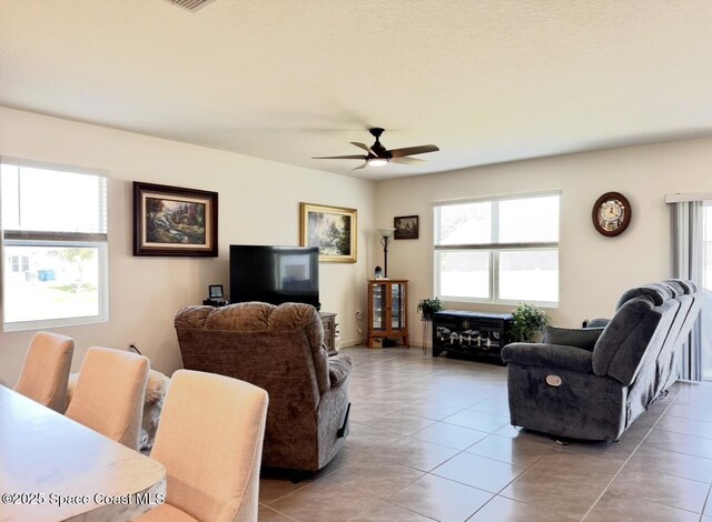 2507 Peralta Dr, Palm Bay, FL 32909 - living area with ceiling fan and light tile patterned flooring