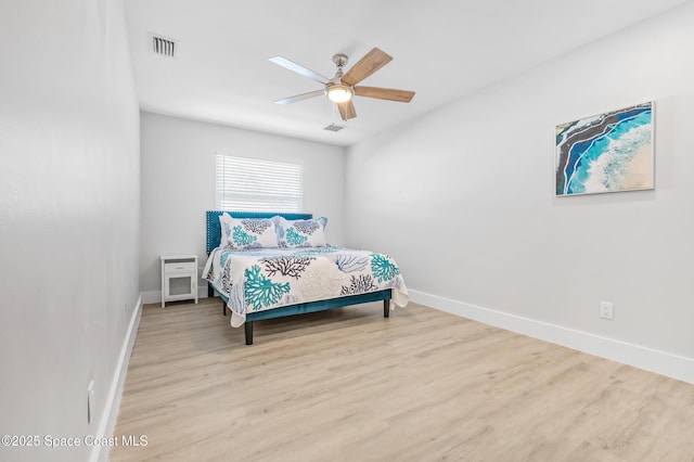6765 Angeles Rd, Melbourne Beach, FL 32951 - bedroom featuring wood finished floors, baseboards, and ceiling fan