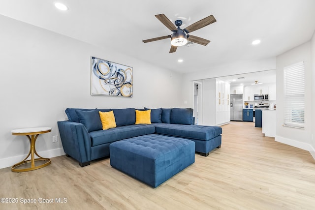 6765 Angeles Rd, Melbourne Beach, FL 32951 - living room with light wood-type flooring, a ceiling fan, baseboards, and recessed lighting
