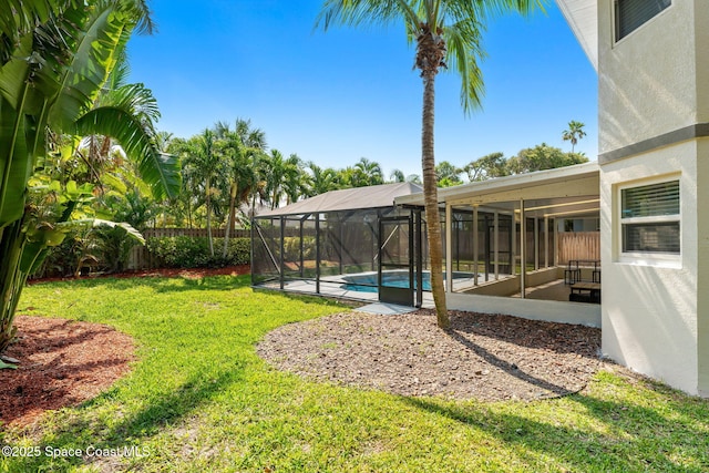 6765 Angeles Rd, Melbourne Beach, FL 32951 - view of yard with glass enclosure and a patio