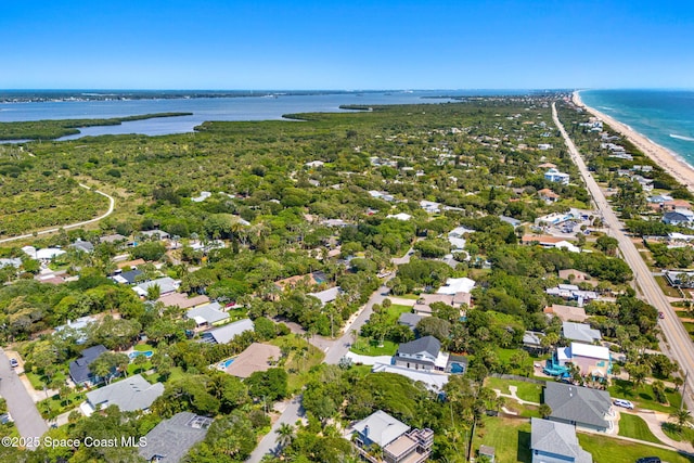 6765 Angeles Rd, Melbourne Beach, FL 32951 - aerial perspective of suburban area featuring a large body of water