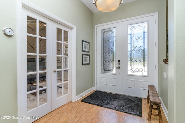 897 Yellow Wood Ct SE, Palm Bay, FL 32909 - entrance foyer with french doors, baseboards, and wood finished floors