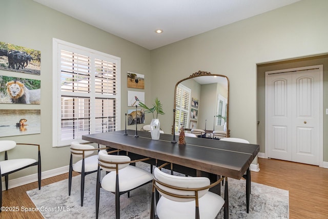 897 Yellow Wood Ct SE, Palm Bay, FL 32909 - dining area with light wood finished floors, baseboards, arched walkways, and recessed lighting