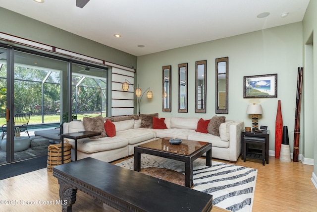897 Yellow Wood Ct SE, Palm Bay, FL 32909 - living room featuring baseboards, light wood finished floors, a sunroom, and recessed lighting